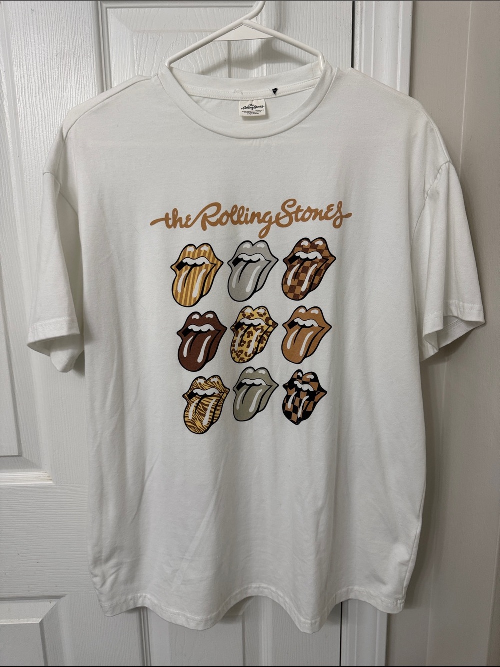 the Rolling Stones White Graphic Tee with Multitone Brown & Gold Tongues